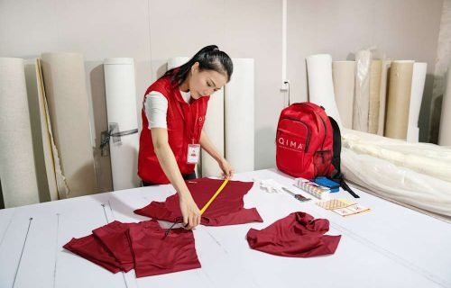 QIMA_inspector_-_performing_inspections_on_garments